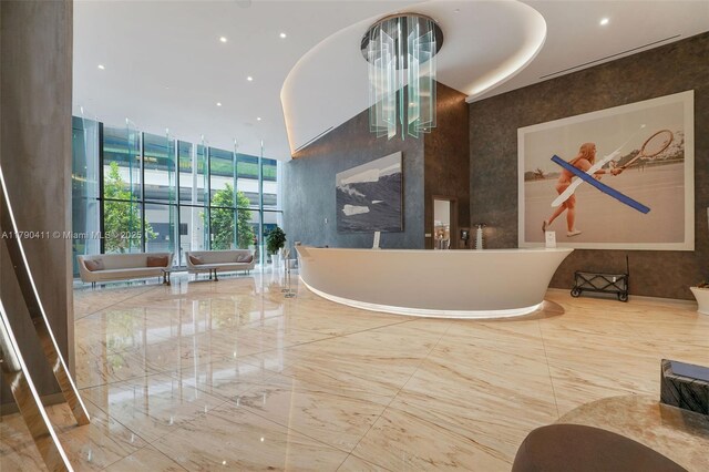 1000 Brickell Plz Unit Ph5603, Miami, FL 33131 - reception area with a towering ceiling and recessed lighting