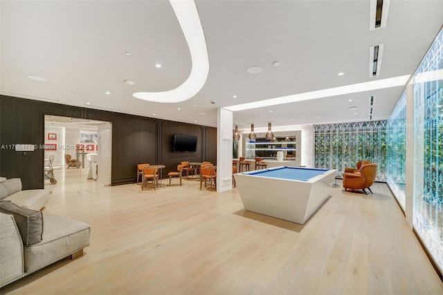1000 Brickell Plz Unit Ph5603, Miami, FL 33131 - recreation room featuring wood finished floors, billiards, expansive windows, and recessed lighting