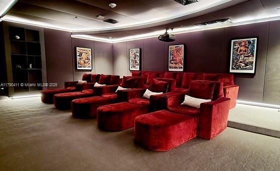 1000 Brickell Plz Unit Ph5603, Miami, FL 33131 - home theater room with carpet floors and a tray ceiling