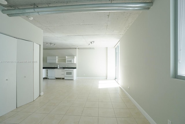 690 SW 1st Ct Unit 2032, Miami, FL 33130 - unfurnished living room with a sink and light tile patterned floors