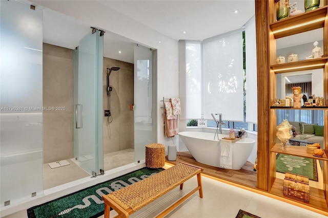 2670 Cypress Ln, Weston, FL 33332 - bathroom featuring a freestanding bath, a shower stall, and recessed lighting