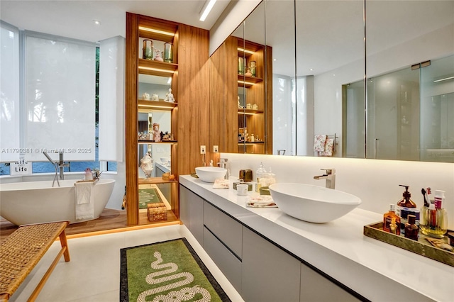 2670 Cypress Ln, Weston, FL 33332 - full bathroom with a freestanding bath, a sink, and double vanity