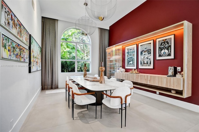 2670 Cypress Ln, Weston, FL 33332 - dining area with a notable chandelier and baseboards