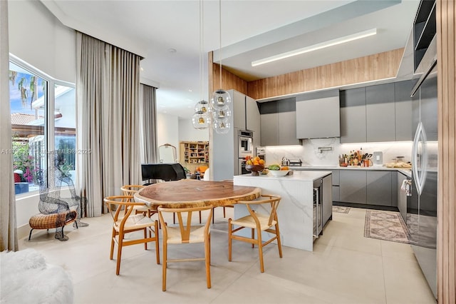 2670 Cypress Ln, Weston, FL 33332 - kitchen featuring a healthy amount of sunlight, light countertops, modern cabinets, and gray cabinetry