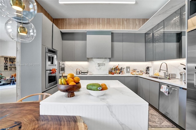 2670 Cypress Ln, Weston, FL 33332 - kitchen with gray cabinetry, stainless steel appliances, modern cabinets, and a sink