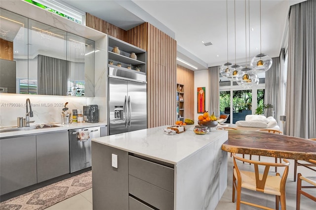 2670 Cypress Ln, Weston, FL 33332 - kitchen featuring stainless steel appliances, open shelves, gray cabinetry, and a sink