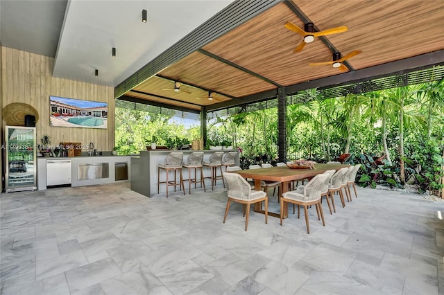 2670 Cypress Ln, Weston, FL 33332 - view of patio with wine cooler, exterior kitchen, ceiling fan, a sink, and outdoor wet bar
