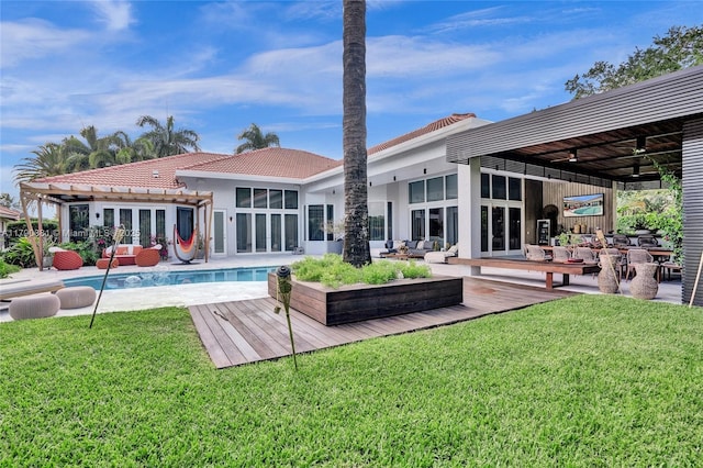 2670 Cypress Ln, Weston, FL 33332 - back of house featuring an outdoor hangout area, an outdoor pool, french doors, and a lawn