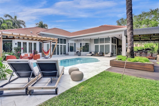 2670 Cypress Ln, Weston, FL 33332 - back of house featuring a tile roof, a patio area, and an outdoor living space