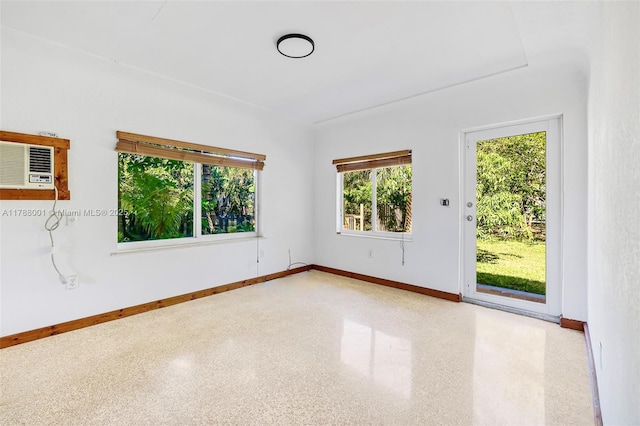 8440 NE 1st Ave, Miami, FL 33138 - spare room featuring a wall mounted AC and baseboards