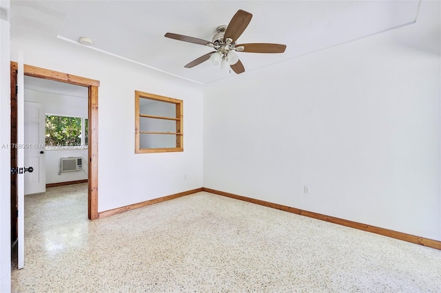 8440 NE 1st Ave, Miami, FL 33138 - spare room with a ceiling fan, baseboards, speckled floor, and a wall mounted air conditioner