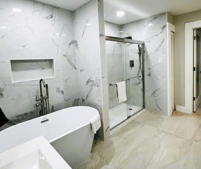 15618 SE US Highway 301, Hawthorne, FL 32640 - bathroom with a freestanding tub, a marble finish shower, and marble finish floors