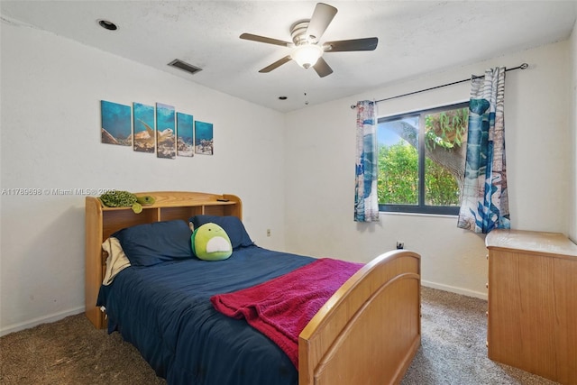 bedroom with baseboards, a ceiling fan, carpet flooring, and visible vents