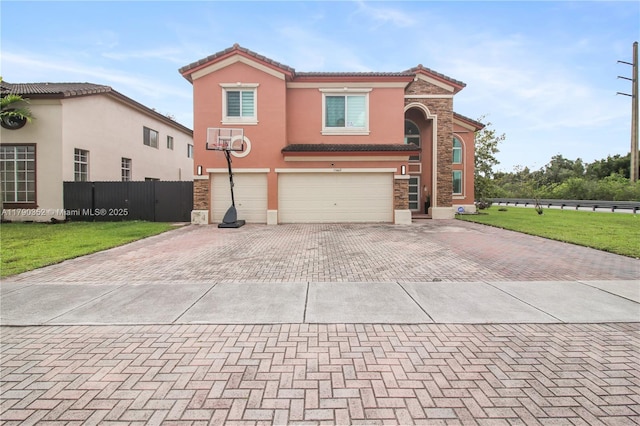 view of front facade featuring fence, stucco siding, decorative driveway, stone siding, and a garage