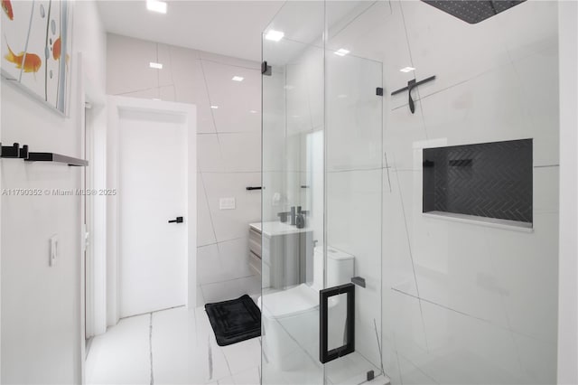 bathroom with tile walls, tile patterned floors, and a shower stall