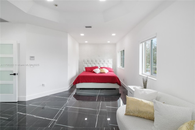 bedroom with granite finish floor, visible vents, baseboards, and recessed lighting