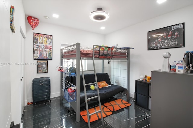 bedroom featuring granite finish floor, baseboards, and recessed lighting
