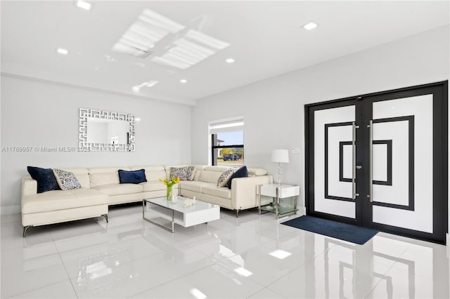 tiled living room with baseboards and recessed lighting