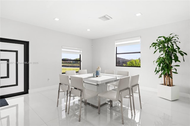dining room with visible vents, baseboards, and light tile patterned floors
