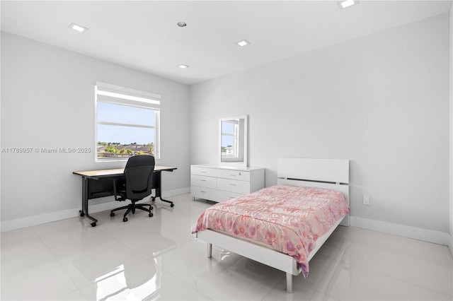 bedroom featuring baseboards and recessed lighting