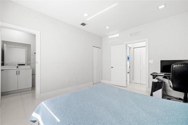 bedroom with ensuite bath, visible vents, recessed lighting, and light tile patterned floors