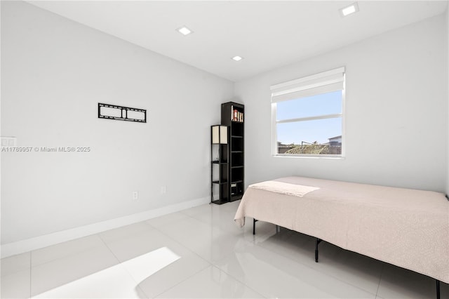bedroom featuring recessed lighting, tile patterned flooring, and baseboards