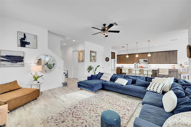 8650 NW 39th Ct, Coral Springs, FL 33065 - living area featuring baseboards, a ceiling fan, recessed lighting, and light wood-style flooring