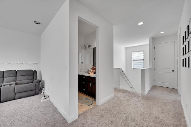 8650 NW 39th Ct, Coral Springs, FL 33065 - corridor with light colored carpet, recessed lighting, baseboards, an upstairs landing, and visible vents
