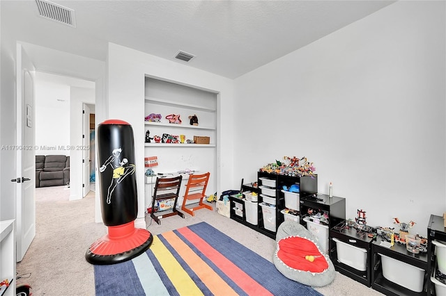 8650 NW 39th Ct, Coral Springs, FL 33065 - playroom featuring visible vents, a textured ceiling, built in features, and carpet floors