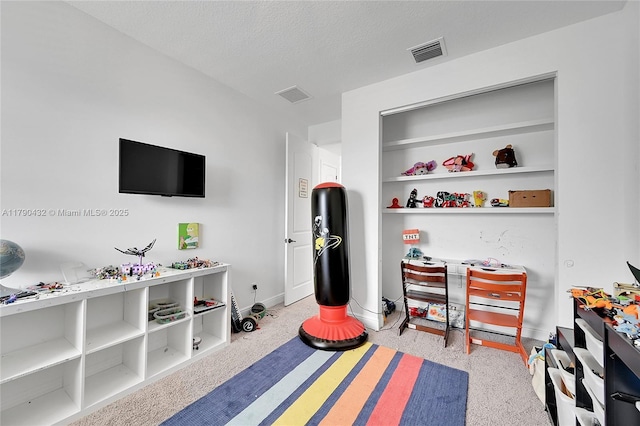 8650 NW 39th Ct, Coral Springs, FL 33065 - recreation room featuring a textured ceiling, baseboards, and visible vents