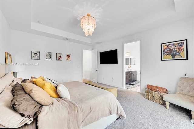 8650 NW 39th Ct, Coral Springs, FL 33065 - bedroom featuring a notable chandelier, ensuite bath, carpet, a tray ceiling, and visible vents