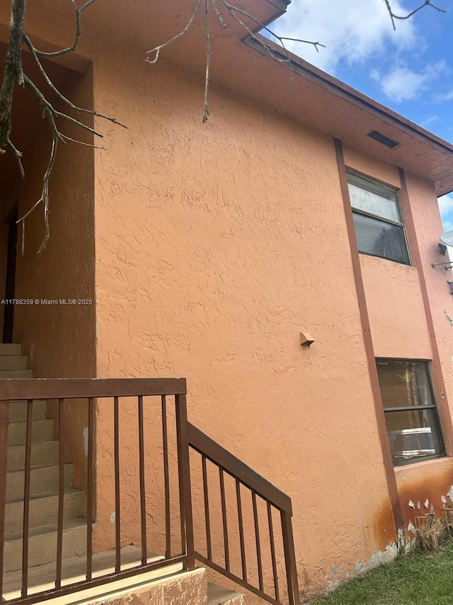 2480 W 67th Pl Unit 12-12, Hialeah, FL 33016 - view of side of property featuring stucco siding