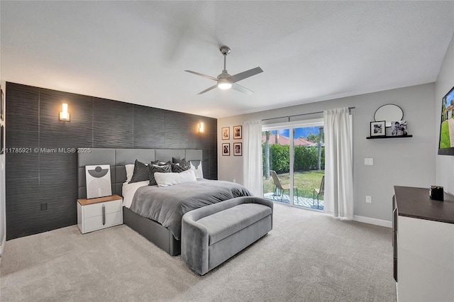 bedroom with carpet, a ceiling fan, baseboards, and access to outside