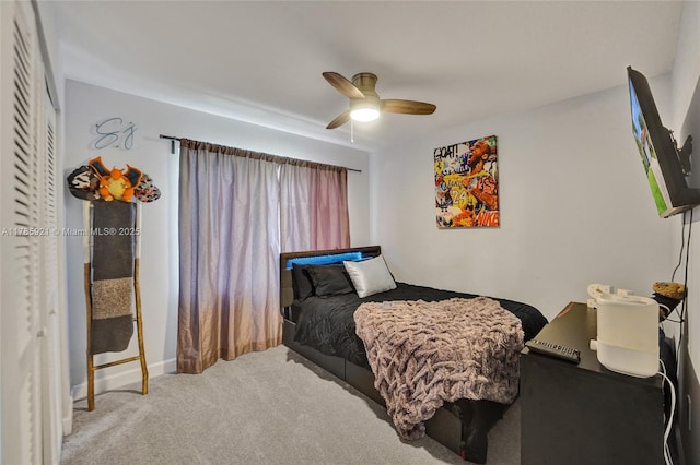 carpeted bedroom with a ceiling fan