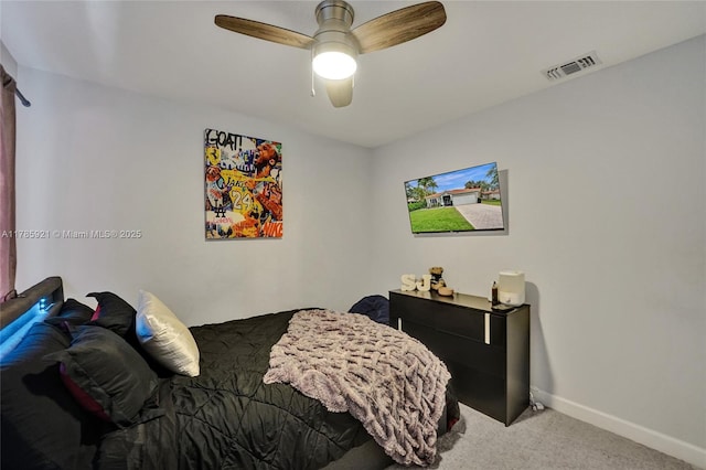 bedroom featuring baseboards, a ceiling fan, visible vents, and carpet flooring