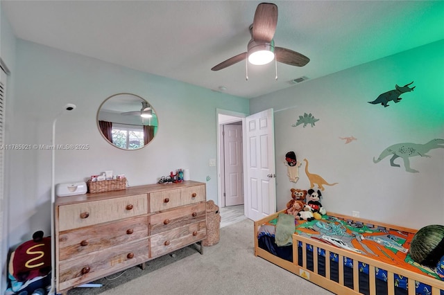 bedroom with ceiling fan, carpet flooring, and visible vents