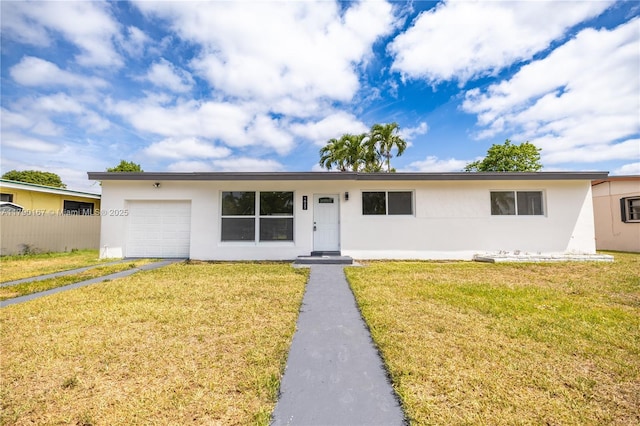 ranch-style house featuring an attached garage, a front lawn, stucco siding, and fence