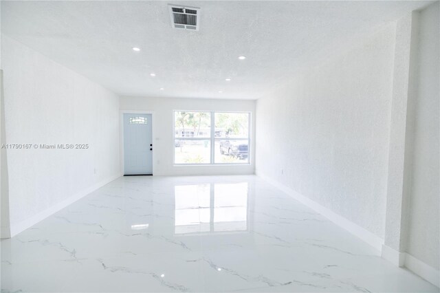 1625 NW 9th Ct, Homestead, FL 33030 - unfurnished room with marble tiled flooring, baseboards, and recessed lighting