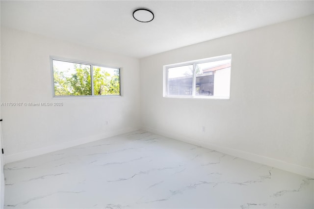 1625 NW 9th Ct, Homestead, FL 33030 - empty room with baseboards and marble finish floors