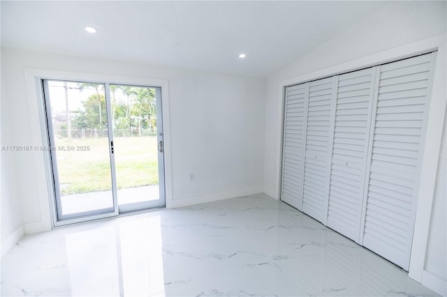 1625 NW 9th Ct, Homestead, FL 33030 - unfurnished bedroom featuring access to outside, light marble finish flooring, recessed lighting, baseboards, and a closet