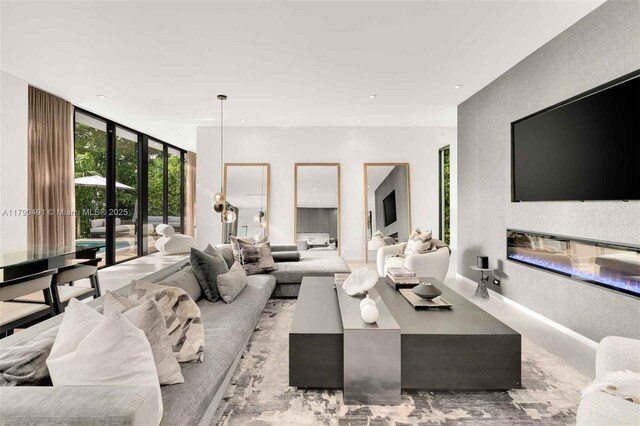 121 2nd Dilido Ter, Share A, Miami Beach, FL 33139 - living room with recessed lighting, floor to ceiling windows, and a glass covered fireplace