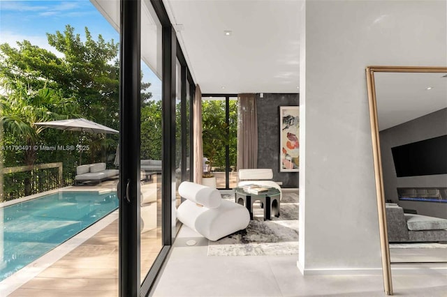 interior space featuring a wall of windows