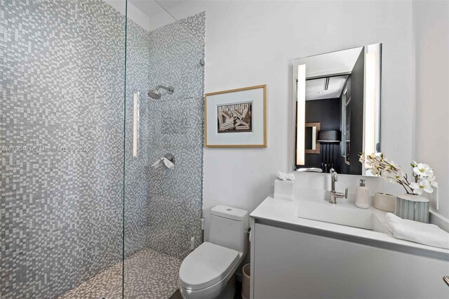 121 2nd Dilido Ter, Share A, Miami Beach, FL 33139 - bathroom featuring toilet, walk in shower, and vanity