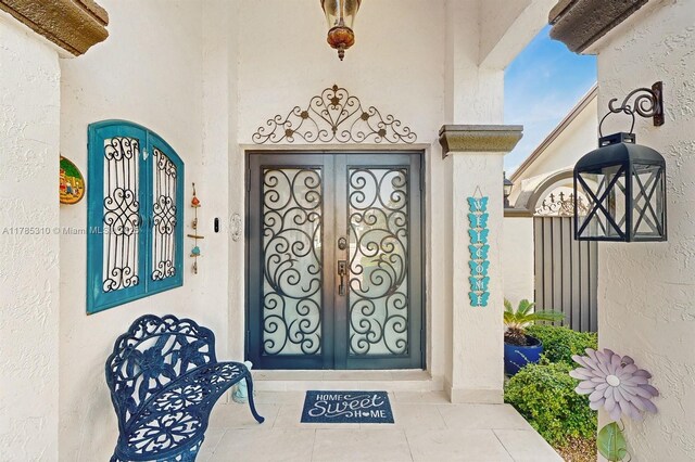 982 NW 133rd Ct, Miami, FL 33182 - doorway to property with stucco siding
