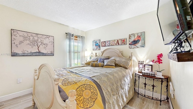 982 NW 133rd Ct, Miami, FL 33182 - bedroom with a textured ceiling and wood finished floors