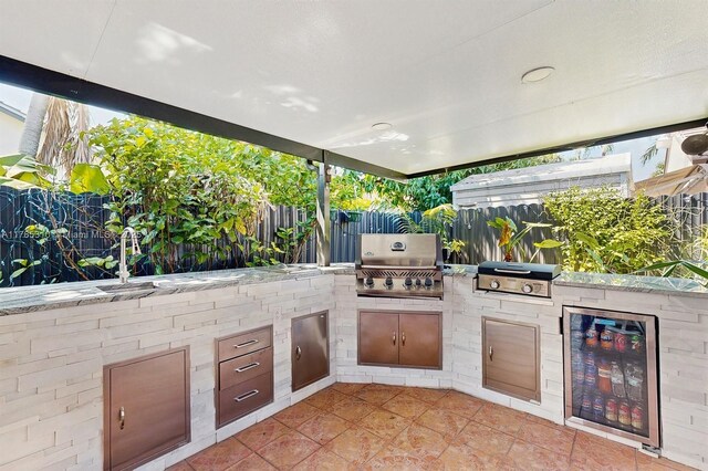 982 NW 133rd Ct, Miami, FL 33182 - view of patio with exterior kitchen and wine cooler