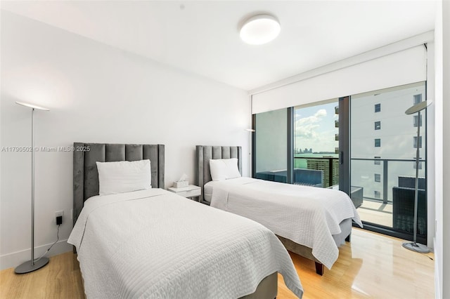 1451 Brickell Ave Unit 1803, Miami, FL 33131 - bedroom featuring access to outside and light wood-style flooring