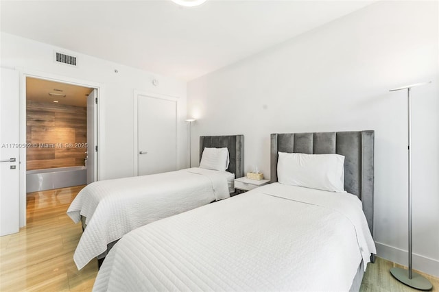 1451 Brickell Ave Unit 1803, Miami, FL 33131 - bedroom featuring visible vents and light wood-style floors