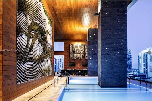1451 Brickell Ave Unit 1803, Miami, FL 33131 - recreation room with wooden walls and wooden ceiling