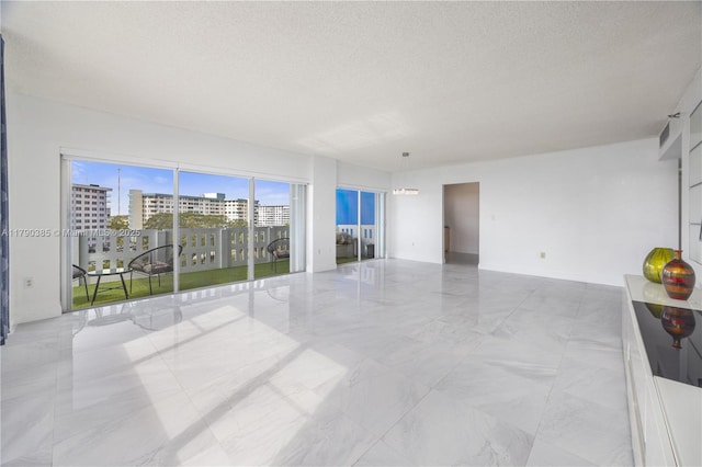 4001 Hillcrest Dr Unit 601, Hollywood, FL 33021 - unfurnished room featuring marble look tile flooring, a textured ceiling, and a city view